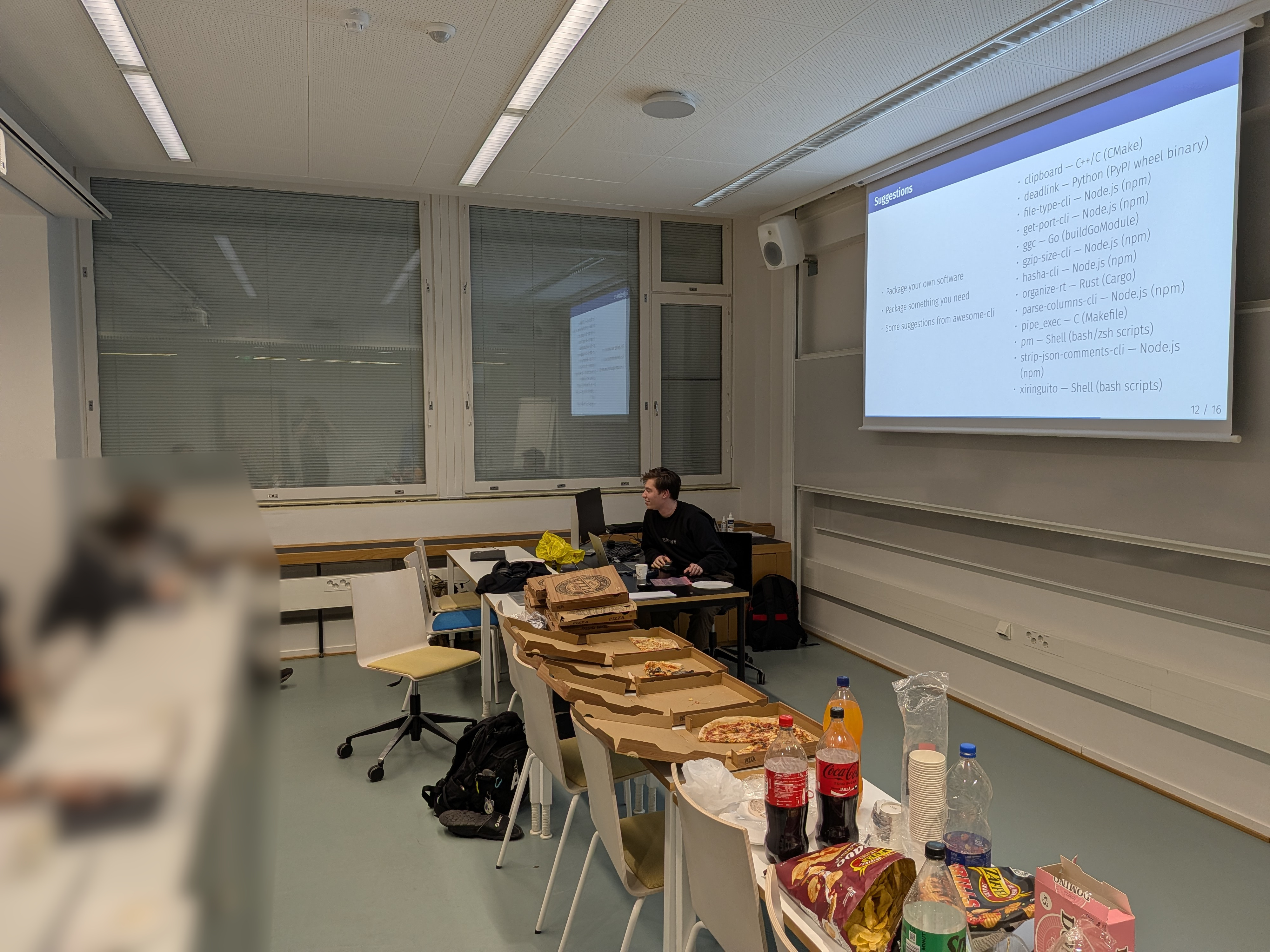 picture with pizza, snacks and ongoing presentation